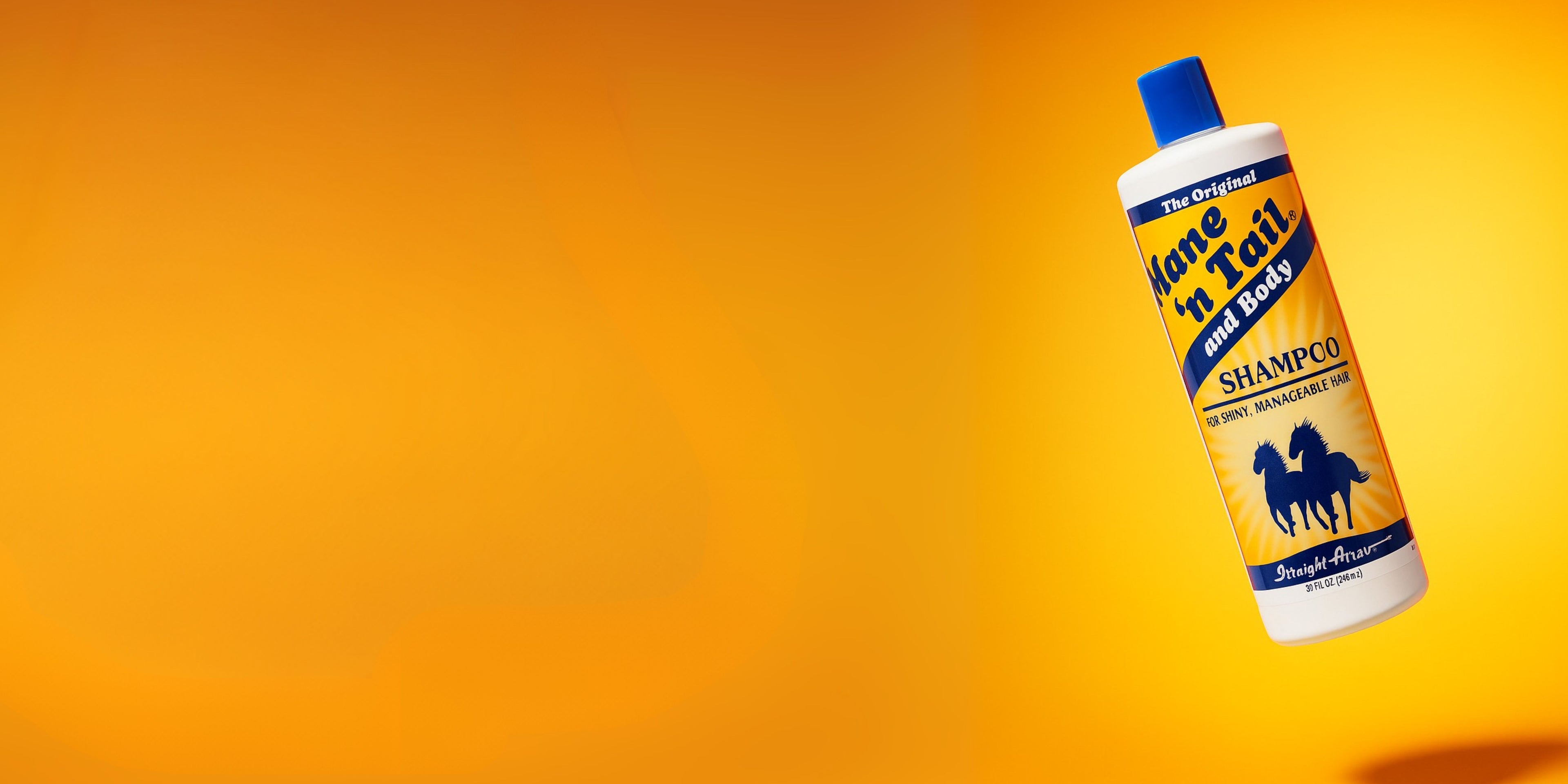Bottle of Mane 'n Tail Shampoo on a gradient orange background